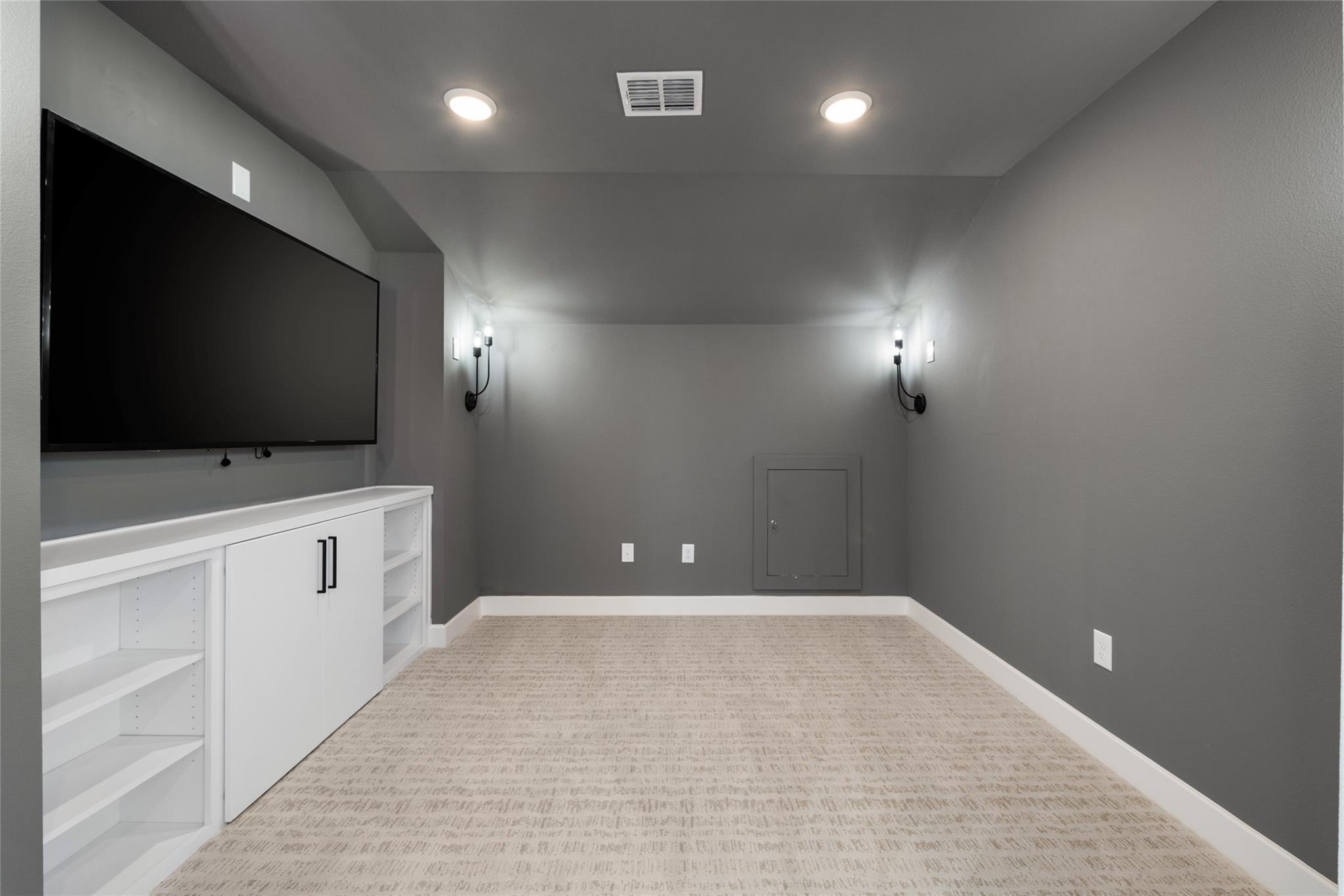 6216 Bower Well Road Austin, TX 78738 - Photo 24 of 31 a view of an empty room and a flat screen tv