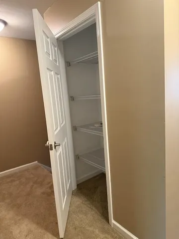 an empty room with a empty space and windows