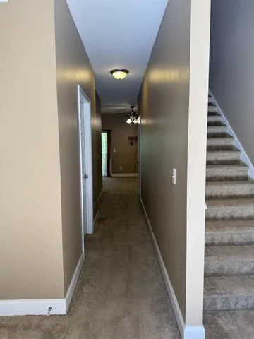 a view of a bathroom from a hallway