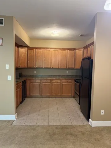 a view of a livingroom with entryway and a window