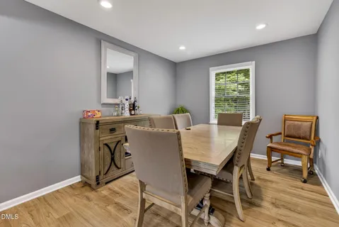 a kitchen with granite countertop a sink stove and cabinets