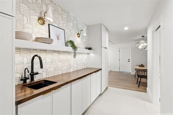 a kitchen with stainless steel appliances a sink and cabinets
