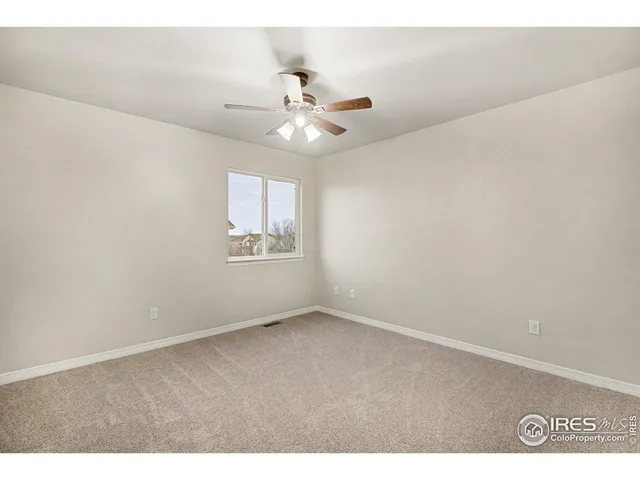 a bathroom with a tub a double vanity sink and a large mirror