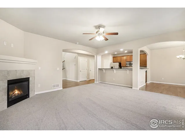 a view of a kitchen with a sink and a refrigerator