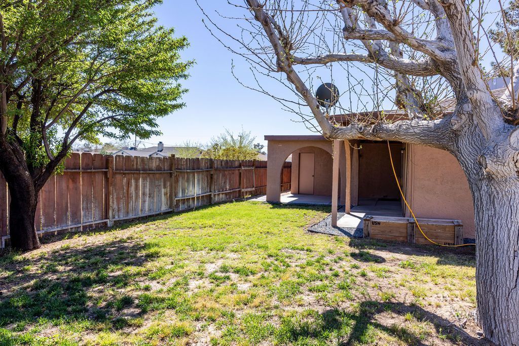 1144 West Benson Avenue Ridgecrest, CA 93555 - Photo 29 of 32 a view of a backyard with a barn