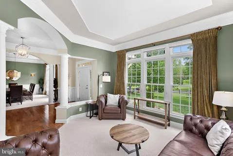 a living room with furniture flat screen tv and a fireplace