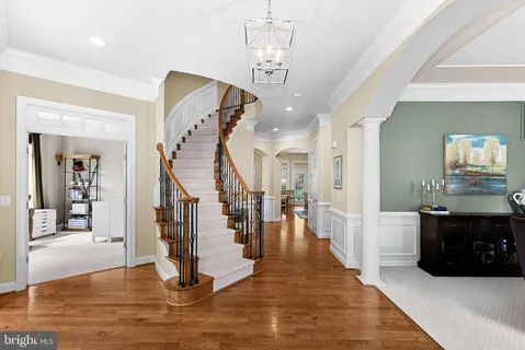 a view of staircase with wooden floor and stairs