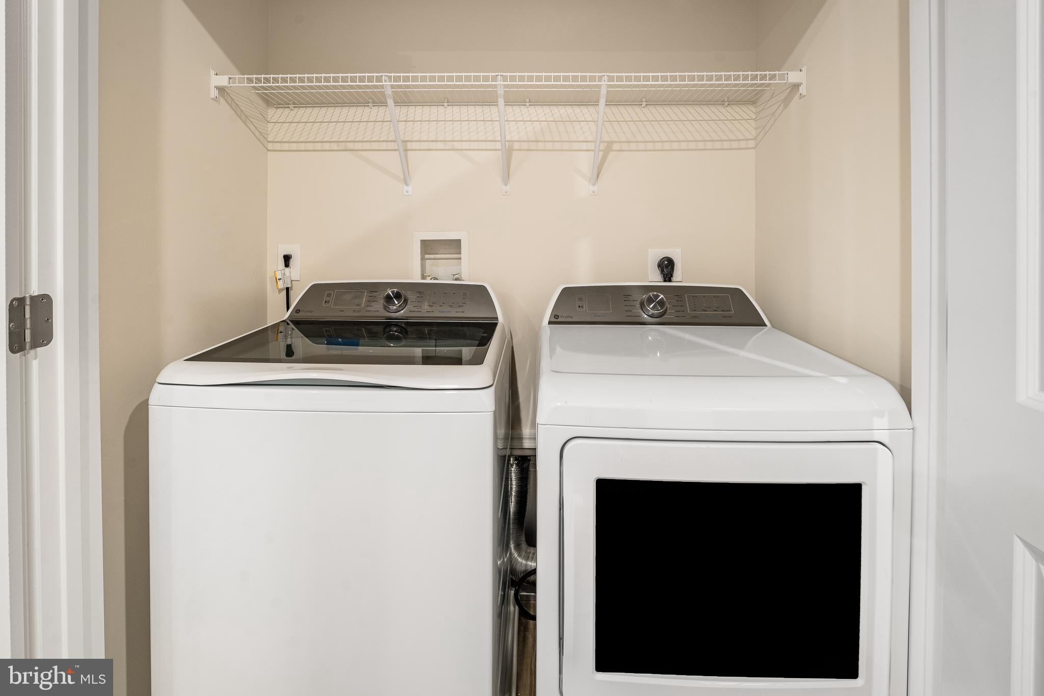 4003 Seaside Alder Road, Unit 208 ROSE Bowie, MD 20720 - Photo 6 of 18 a utility room with dryer and washer