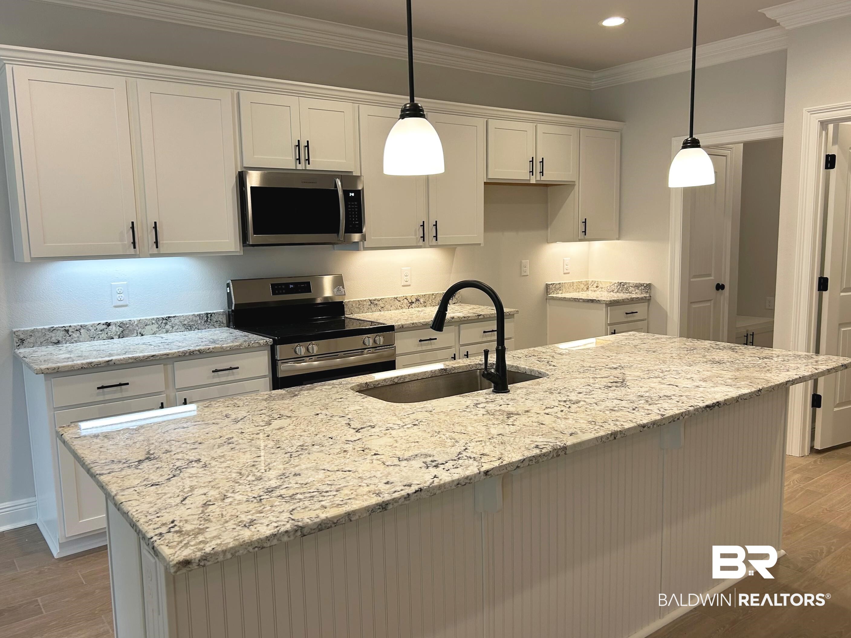 860 Sumter Loop Foley, AL 36535 - Photo 6 of 26 Kitchen featuring appliances with stainless steel finishes, white cabinetry, and pendant lighting