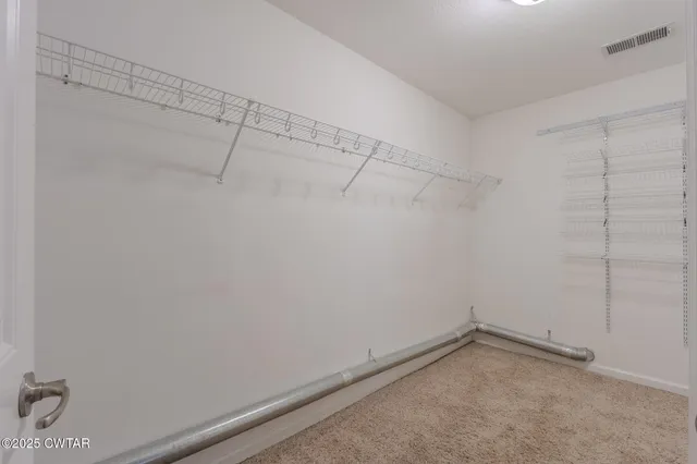 a bathroom with a granite countertop sink a mirror and bathtub