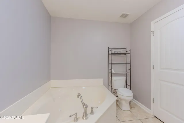 a bathroom with a sink double vanity and a mirror