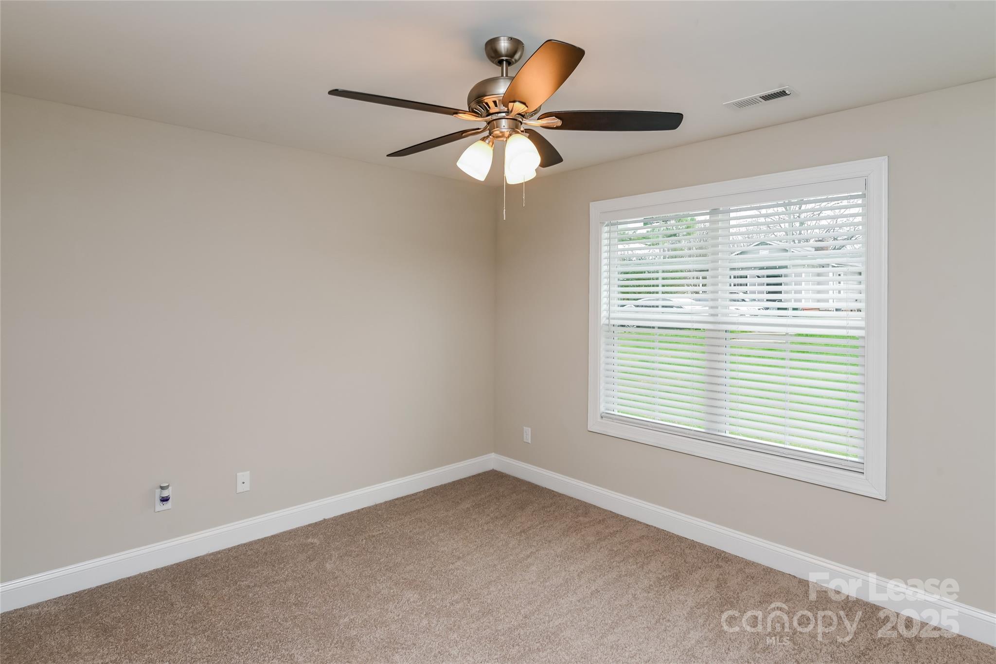 131 Powder Street Southwest Concord, NC 28025 - Photo 12 of 14 a view of an empty room with a window