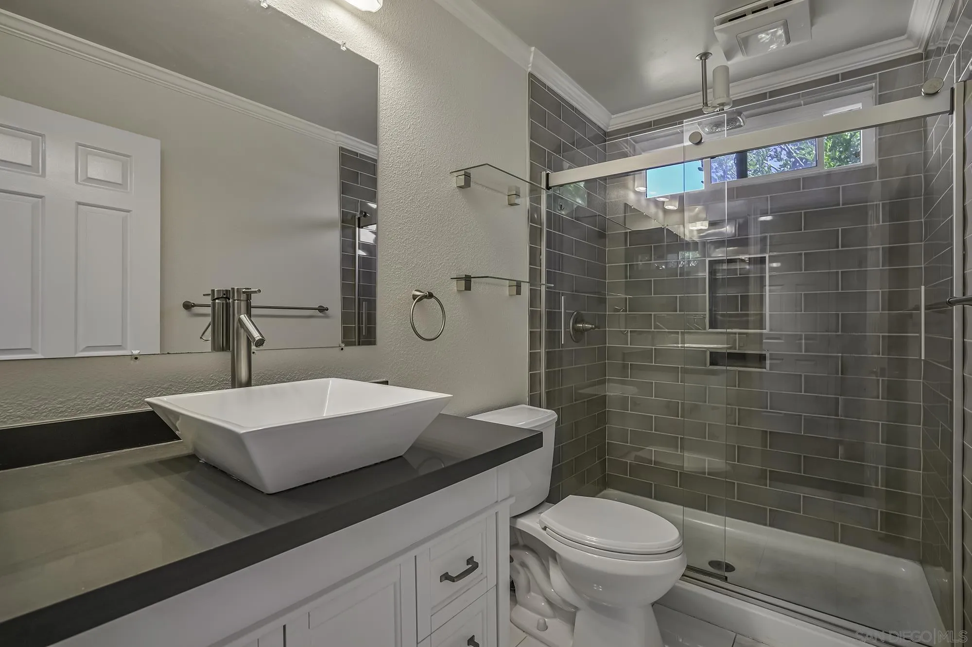 139 Mangano Circle Encinitas, CA 92024 - Photo 13 of 18 a bathroom with a sink a toilet and shower