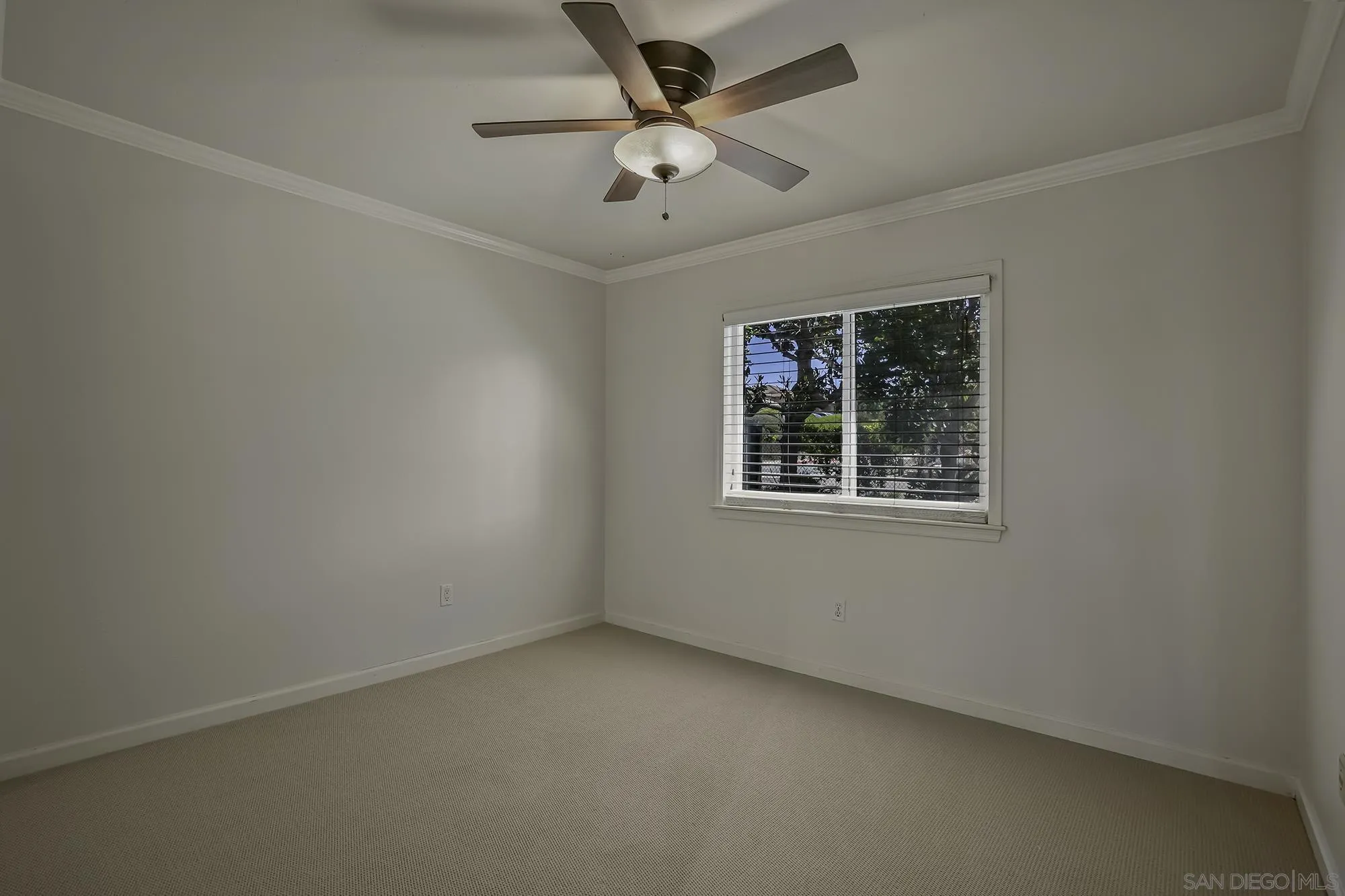139 Mangano Circle Encinitas, CA 92024 - Photo 15 of 18 an empty room with a window and a fan