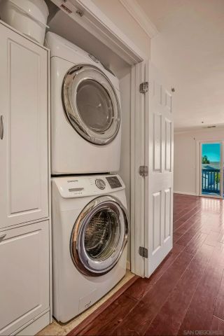 a view of a hallway with washer and dryer