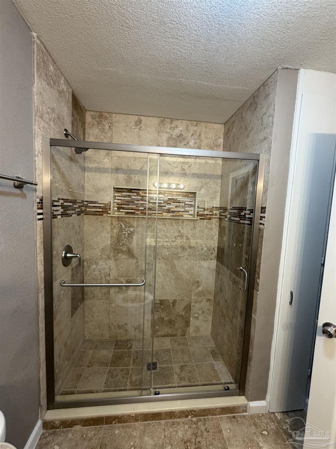 932 Fremont Avenue Pensacola, FL 32505 - Photo 11 of 16 a bathroom with a shower