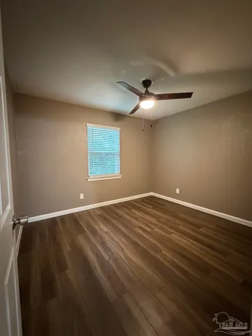 a bathroom with a granite countertop sink a shower and a mirror