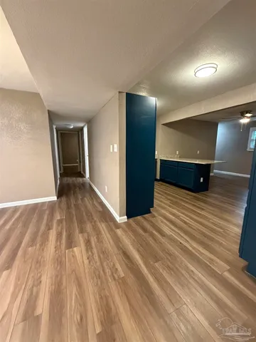 a kitchen with granite countertop cabinets stainless steel appliances and a sink