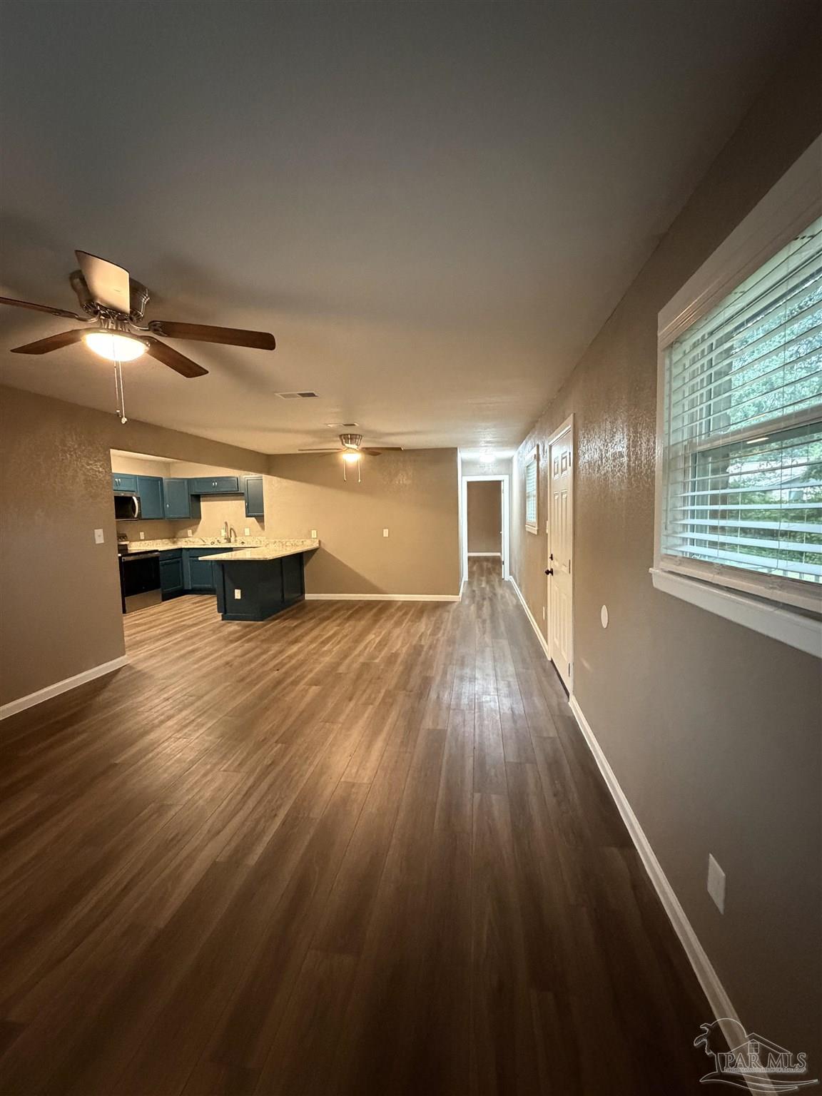 932 Fremont Avenue Pensacola, FL 32505 - Photo 9 of 16 a view of empty room with wooden floor