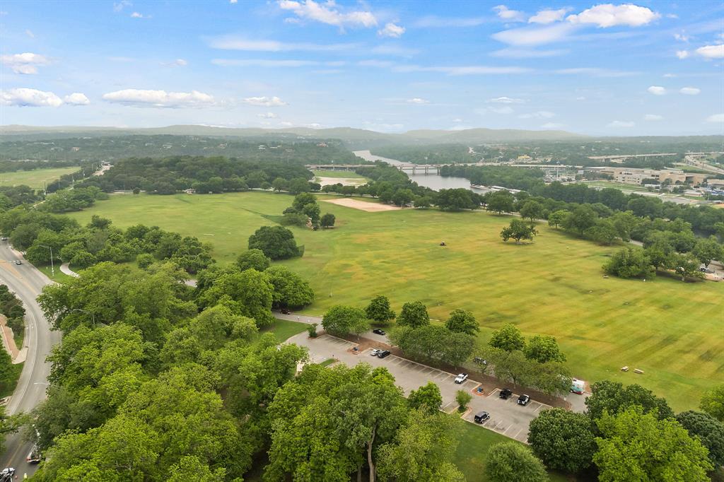 1900 Barton Springs Road, Unit 3040 Austin, TX 78704 - Photo 5 of 38 Expansive green fields bordered by mature trees
