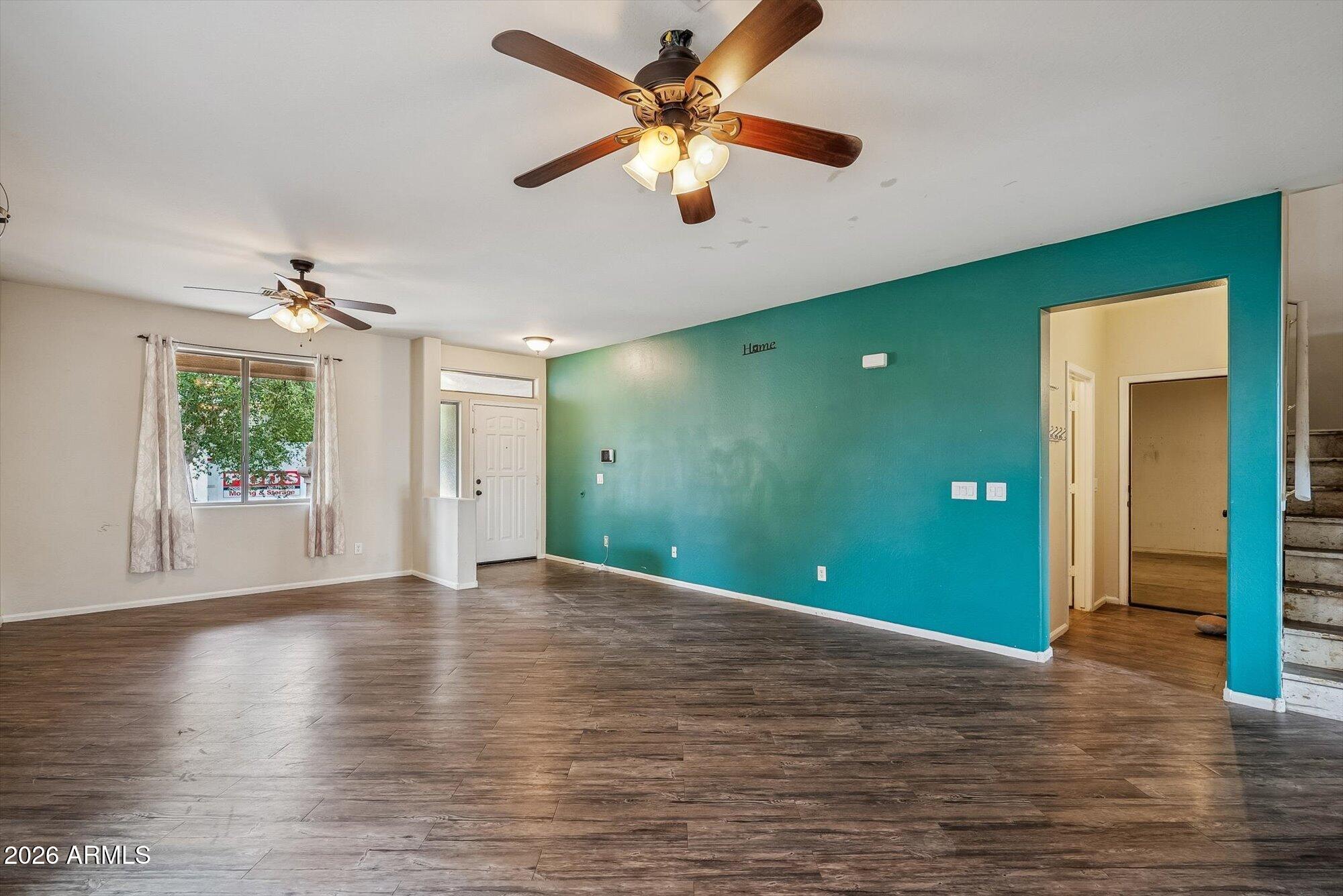 3903 East Citrine Road San Tan Valley, AZ 85143 - Photo 10 of 34 a view of an empty room with window and wooden floor