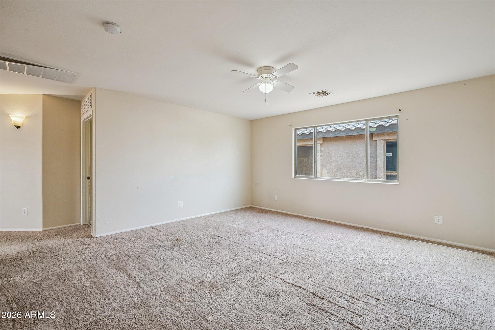 3903 East Citrine Road San Tan Valley, AZ 85143 - Photo 13 of 34 a view of an empty room with a window