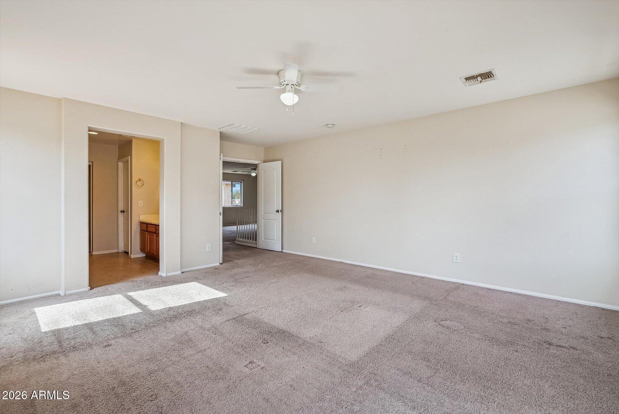 3903 East Citrine Road San Tan Valley, AZ 85143 - Photo 15 of 34 a view of an empty room with closet and a bathroom