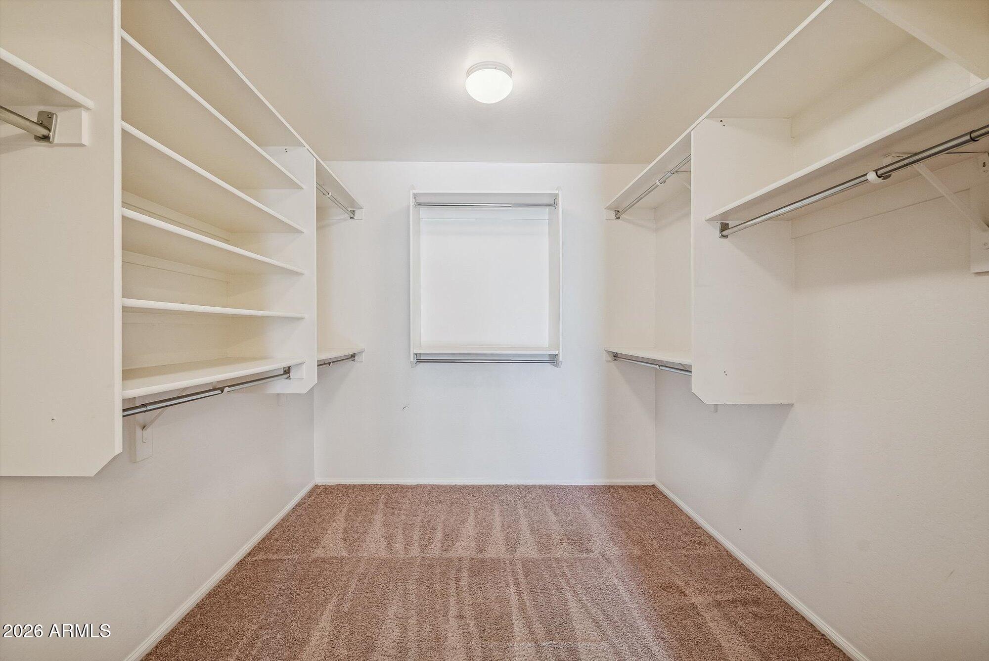 3903 East Citrine Road San Tan Valley, AZ 85143 - Photo 17 of 34 a view of an empty walk in closet