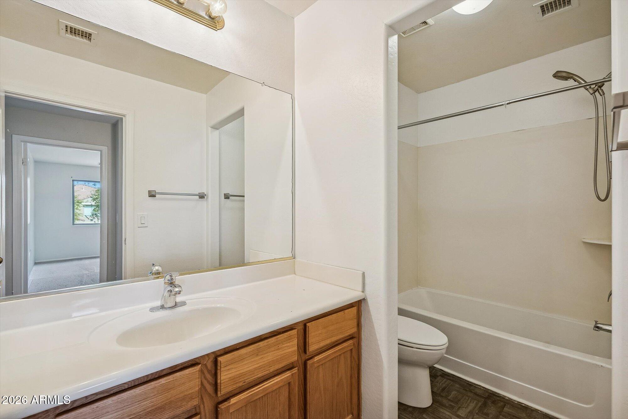3903 East Citrine Road San Tan Valley, AZ 85143 - Photo 18 of 34 a bathroom with a sink toilet and shower