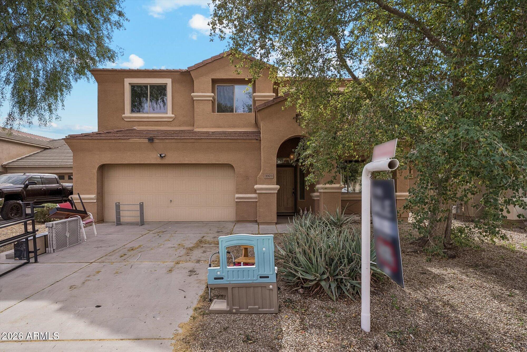3903 East Citrine Road San Tan Valley, AZ 85143 - Photo 2 of 34 a front view of a house with a yard