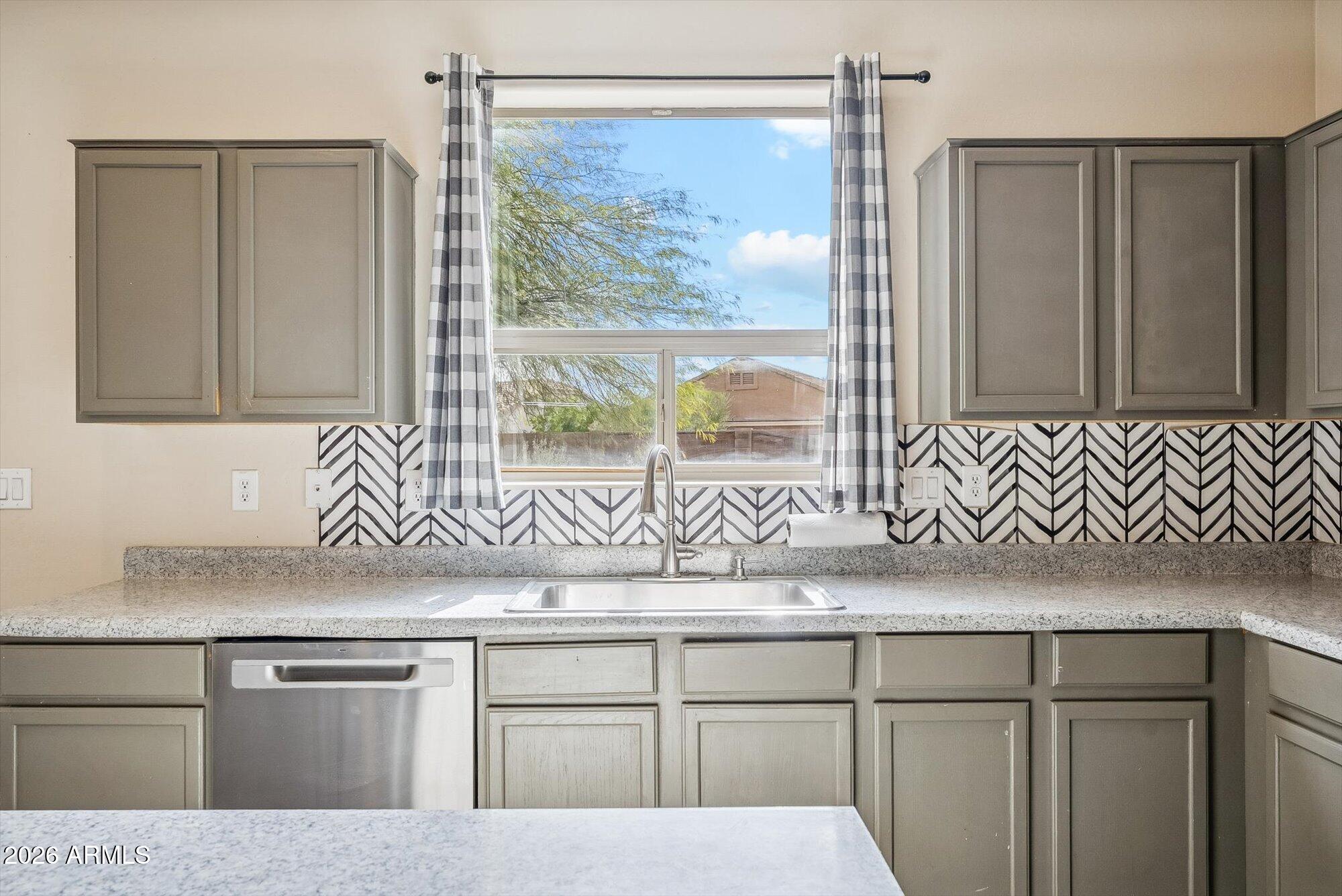 3903 East Citrine Road San Tan Valley, AZ 85143 - Photo 5 of 34 a kitchen with stainless steel appliances granite countertop a refrigerator and a sink
