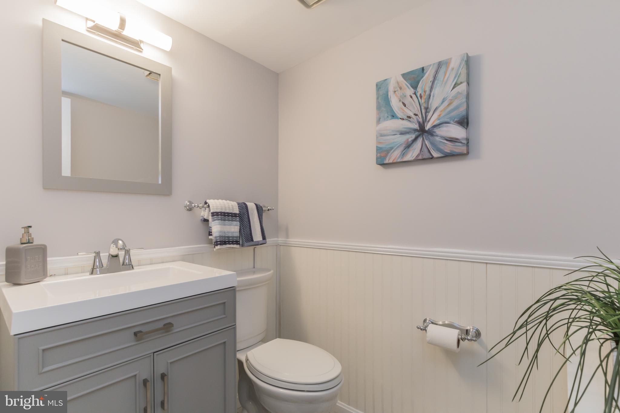 17120 Whites Road Poolesville, MD 20837 - Photo 23 of 30 a bathroom with a toilet a sink and mirror
