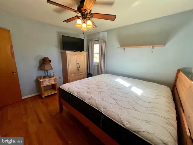 a living room with furniture rug and a window