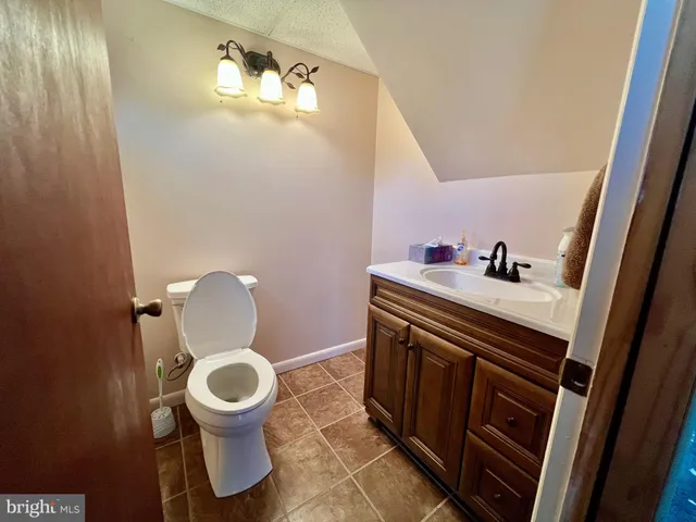 a view of a chairs and table in patio