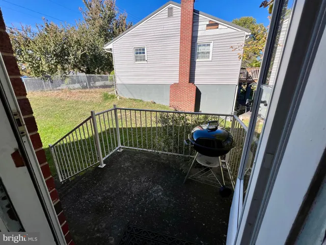 a view of balcony with furniture
