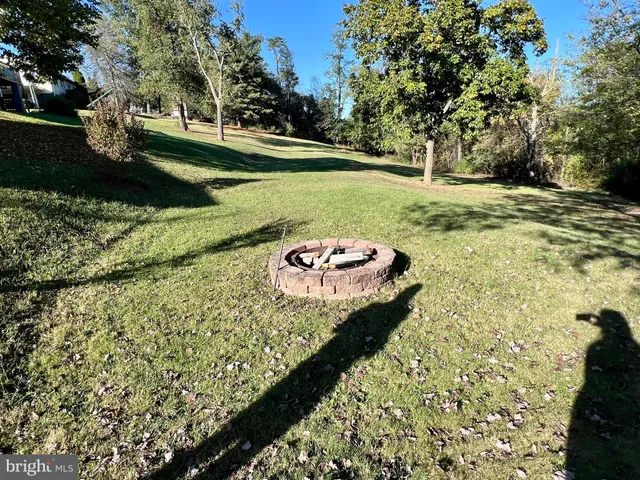 a bedroom with furniture and a large window