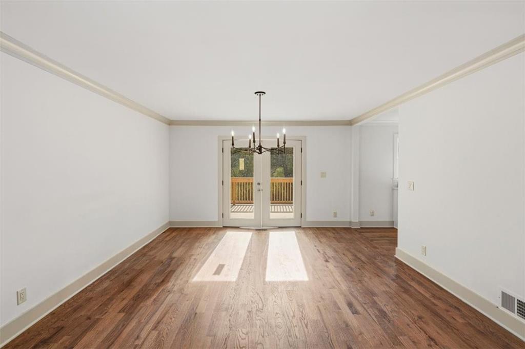 49 Apache Trail Cartersville, GA 30120 - Photo 15 of 52 a view of an empty room with wooden floor and a window