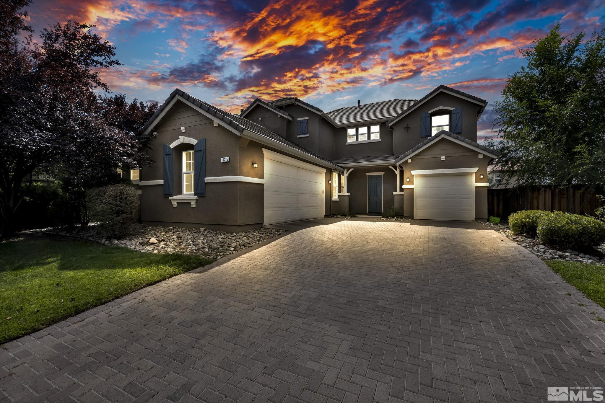 11275 Torino Way Reno, NV 89521 - Photo 2 of 37 a front view of a house with a yard and garage