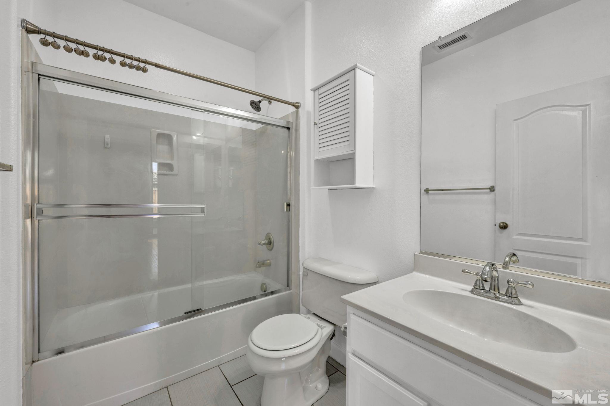 11275 Torino Way Reno, NV 89521 - Photo 23 of 37 a bathroom with a sink toilet and shower