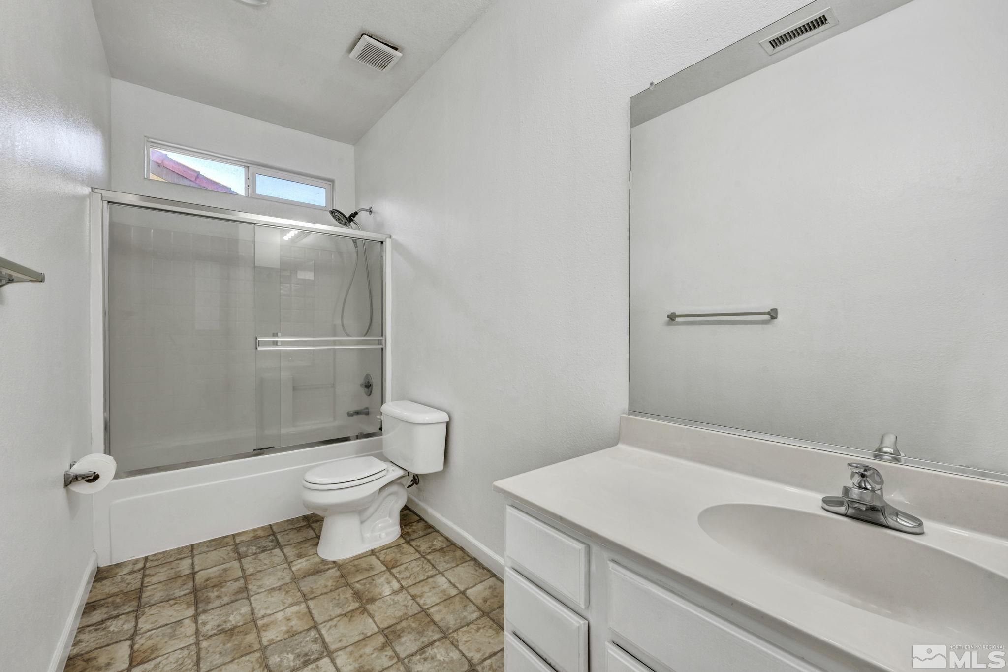 11275 Torino Way Reno, NV 89521 - Photo 24 of 37 a bathroom with a sink toilet and shower