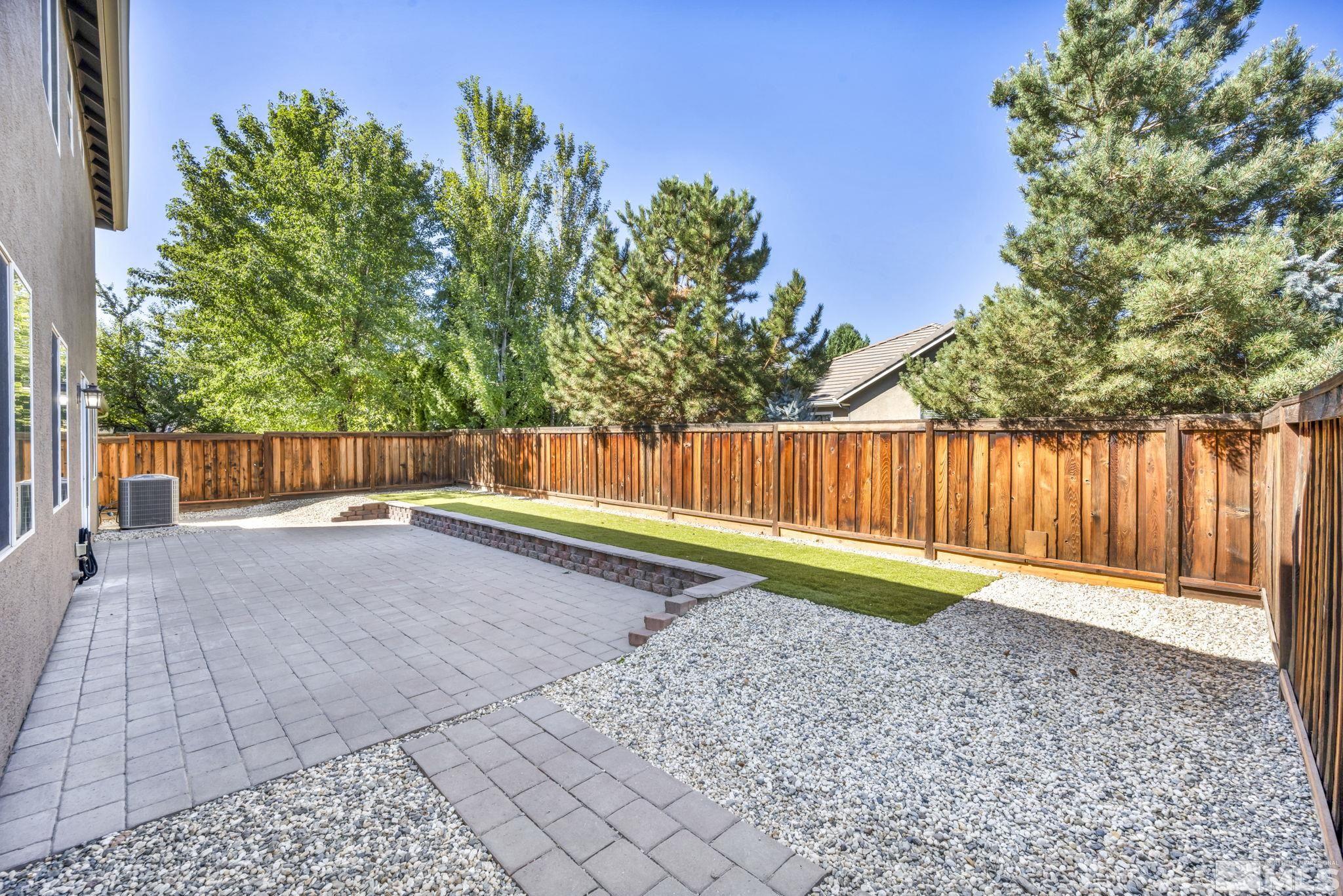11275 Torino Way Reno, NV 89521 - Photo 30 of 37 a view of a backyard with wooden fence