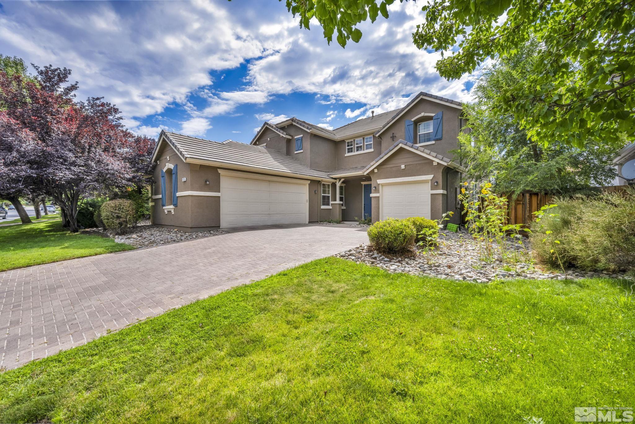 11275 Torino Way Reno, NV 89521 - Photo 34 of 37 a front view of a house with a yard and garage