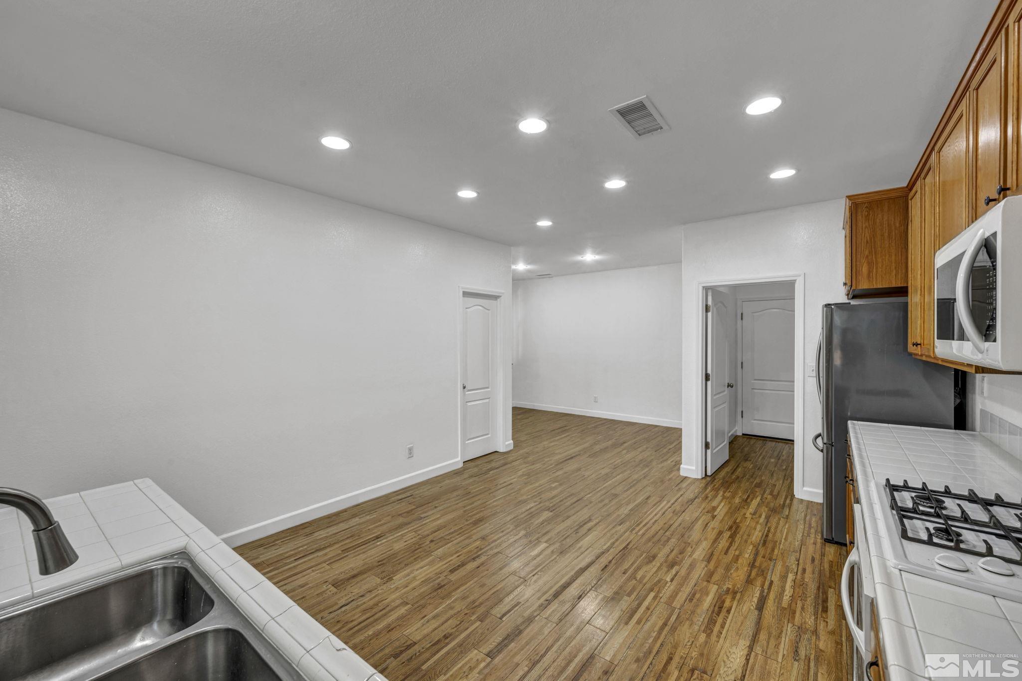 11275 Torino Way Reno, NV 89521 - Photo 37 of 37 a view of an empty room with wooden floor