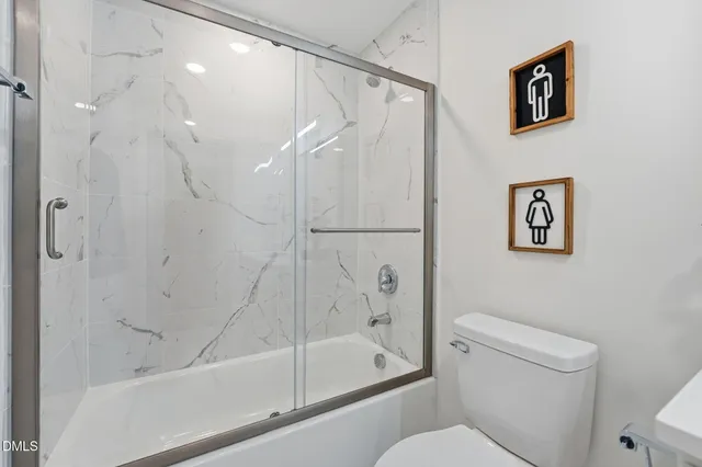 a bathroom with a shower and a toilet
