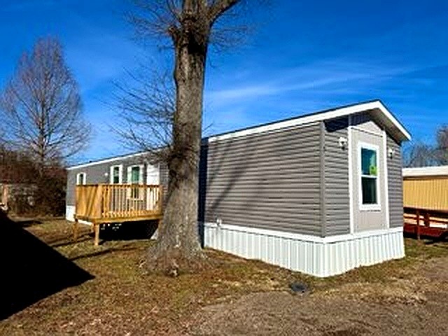 295 Cotham Drive Huntingdon, TN 38344 - Photo 1 of 19 a front view of a house with a yard