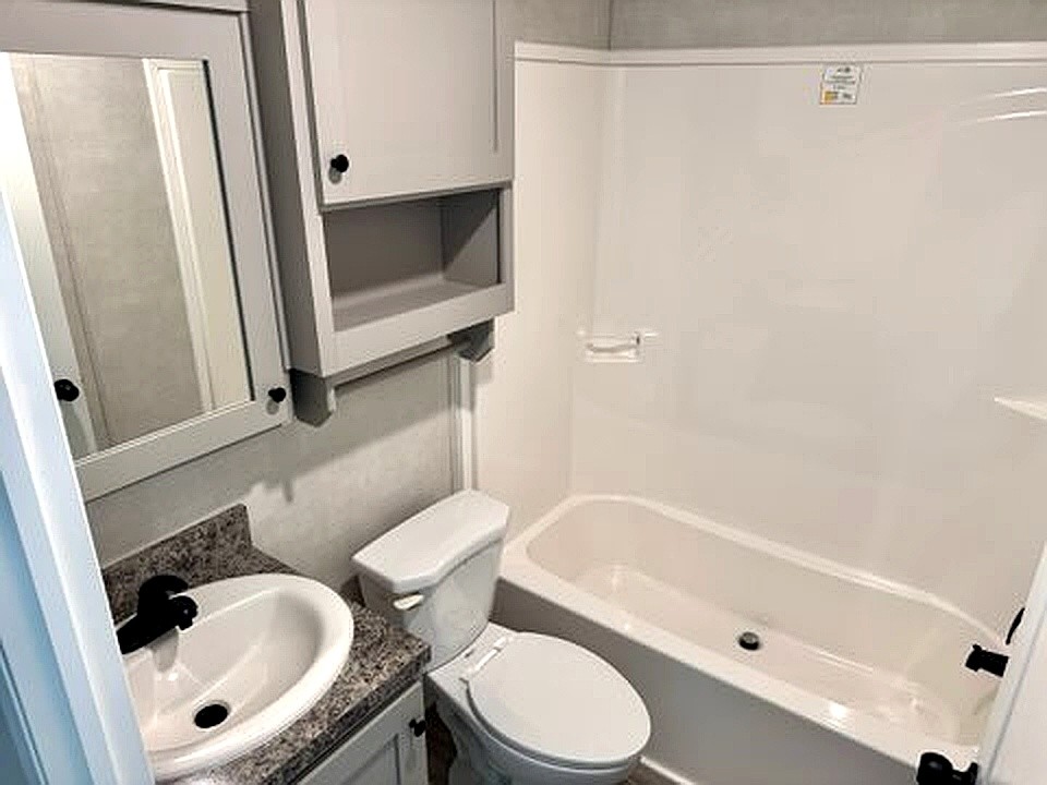 295 Cotham Drive Huntingdon, TN 38344 - Photo 14 of 19 a bathroom with a toilet and a tub