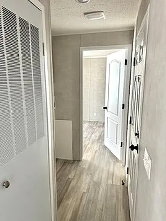 a view of a bathroom from the hallway