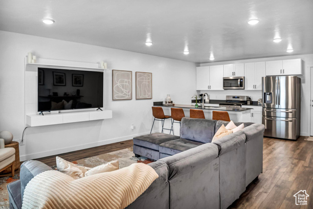 558 Hal Street, Unit 154 Tooele, UT 84074 - Photo 1 of 1 Living room with dark hardwood / wood-style floors and sink