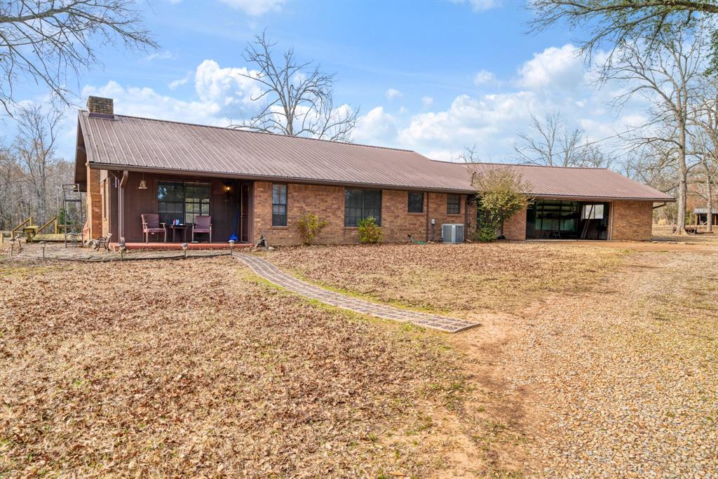 595 County Road Powderly, TX 75473 - Photo 25 of 25 a view of a house with a outdoor space