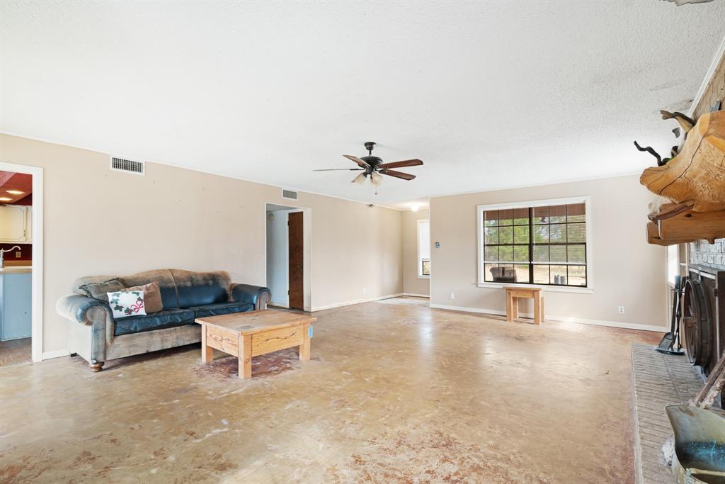595 County Road Powderly, TX 75473 - Photo 4 of 25 a living room with furniture and a window